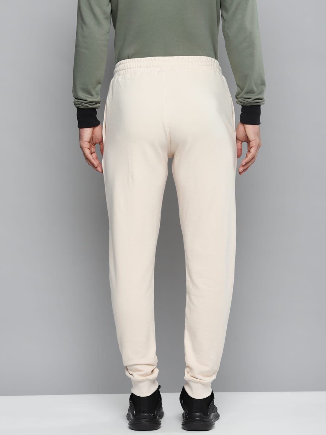 Alcis Men Off-White Solid Slim Fit Joggers with Printed Detail