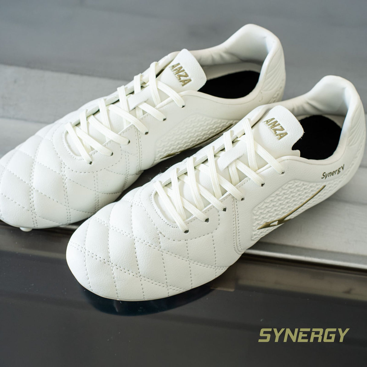 Anza Synergy White and Gold Classic Studs - Image 2 | KIBI SPORTS