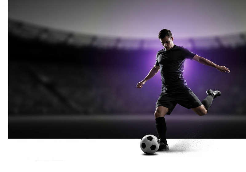 Footballer striking the ball