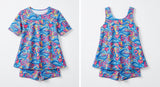 VIVA Swimming LOVE sublimated pattern, ared A-line Half sleeve Top paired with attached boy leg sublimated pattern, ared A-line sleeveless Top paired with attached boy leg - studio shot